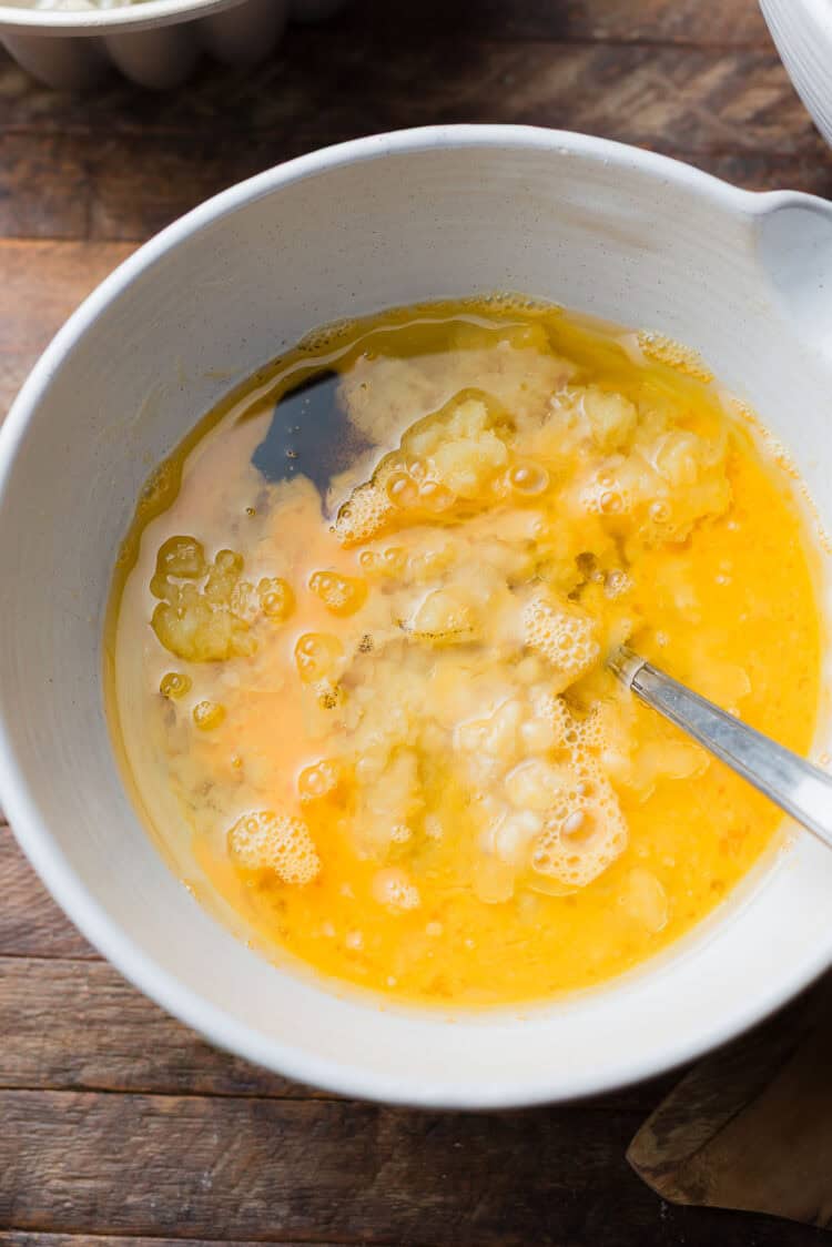 Combining wet ingredients for banana pineapple cake.