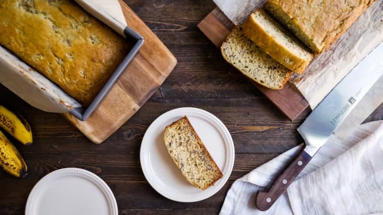 Buttermilk Banana Bread sliced on a cutting board