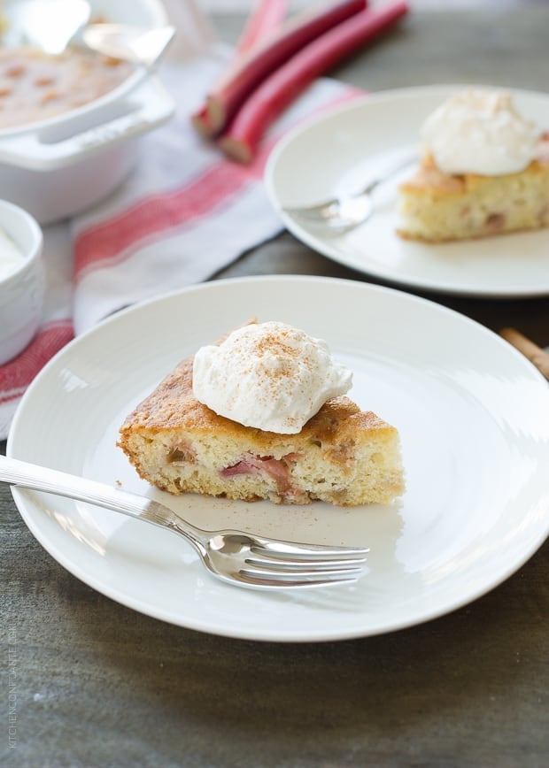 A slice of rhubarb cake on a white plate.