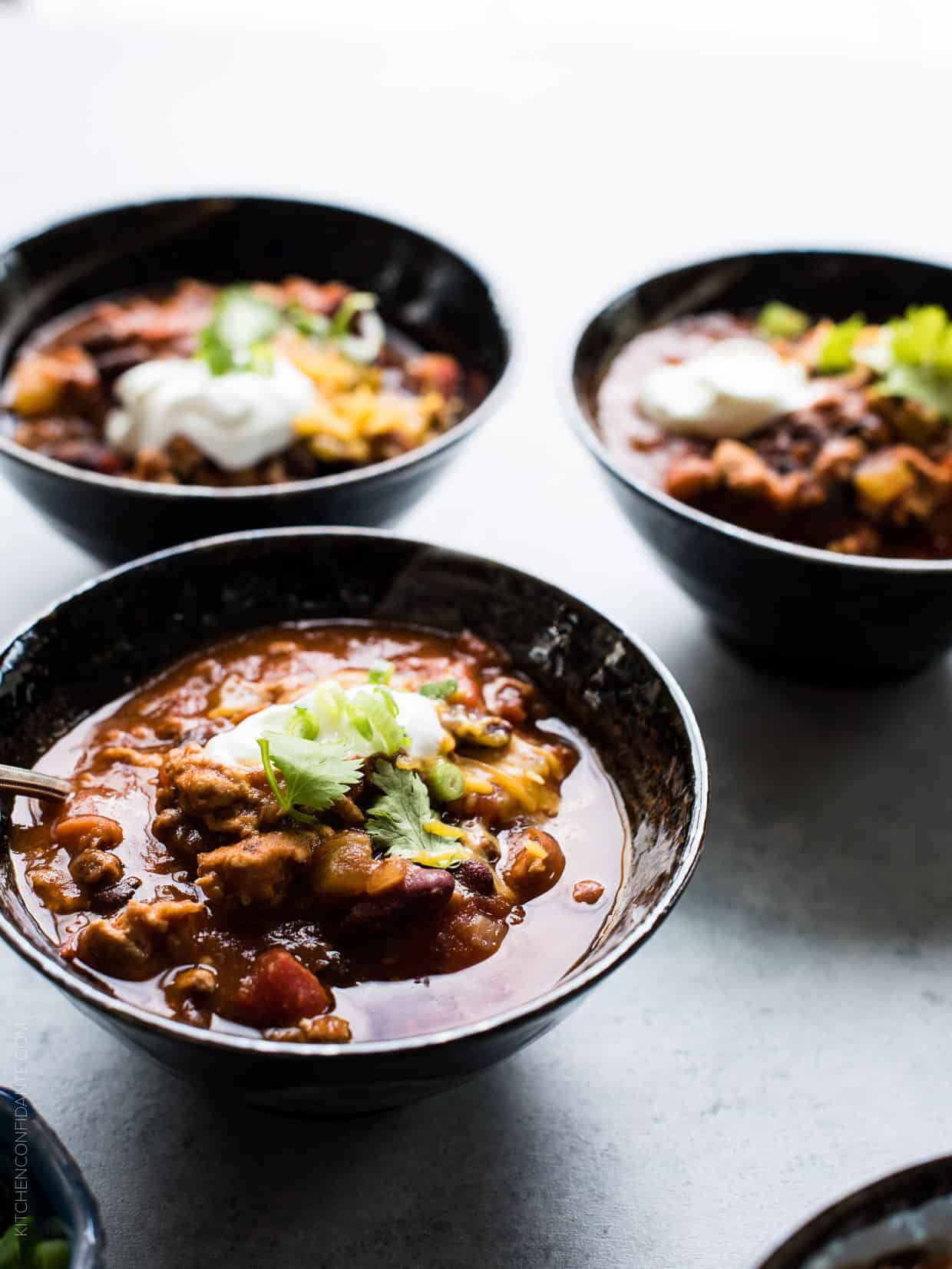 Classic Chili garnished with shredded cheese, sour cream, green onions and cilantro. 