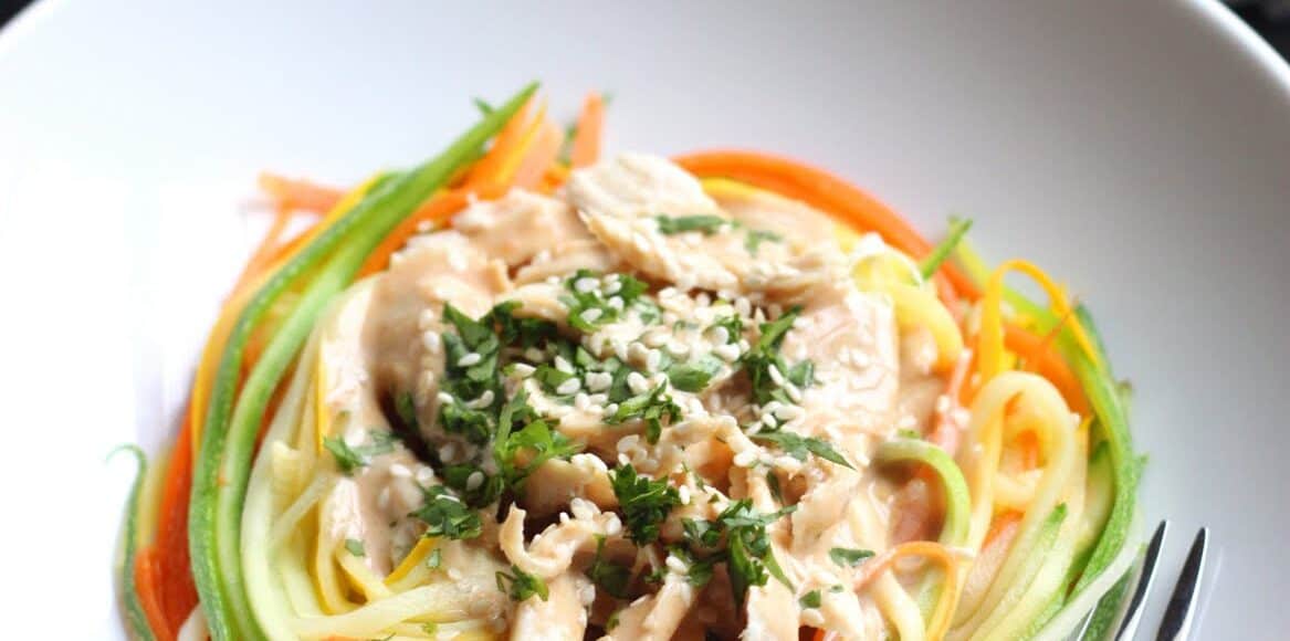 Zucchini Noodles with Chicken and Tangy Peanut Sauce in a white bowl