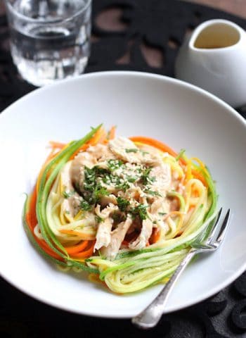 Zucchini Noodles with Chicken and Tangy Peanut Sauce in a white bowl
