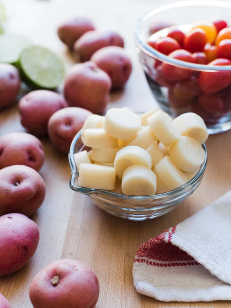 Hearts of palm, red potatoes, cherry tomatoes, and lime for Southwestern Potato Salad.