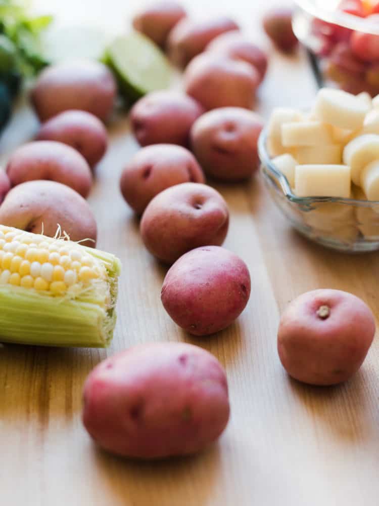 Red potatoes, corn on the cob, and hearts of palm to make Southwestern Potato Salad.