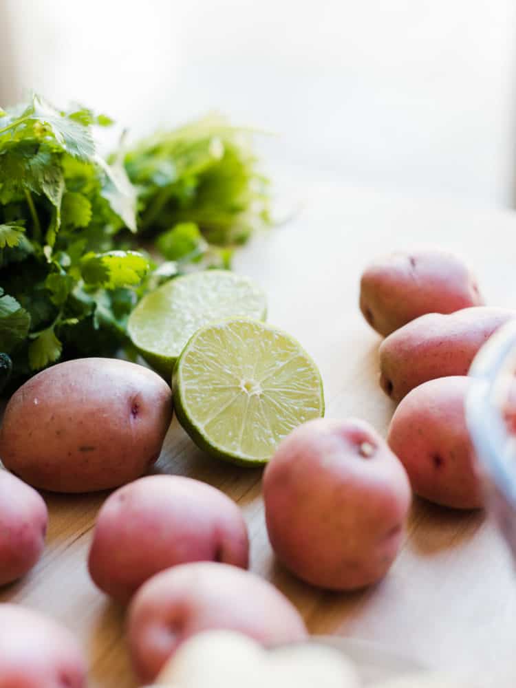 Red potatoes, lime, and cilantro for Southwestern Potato Salad.