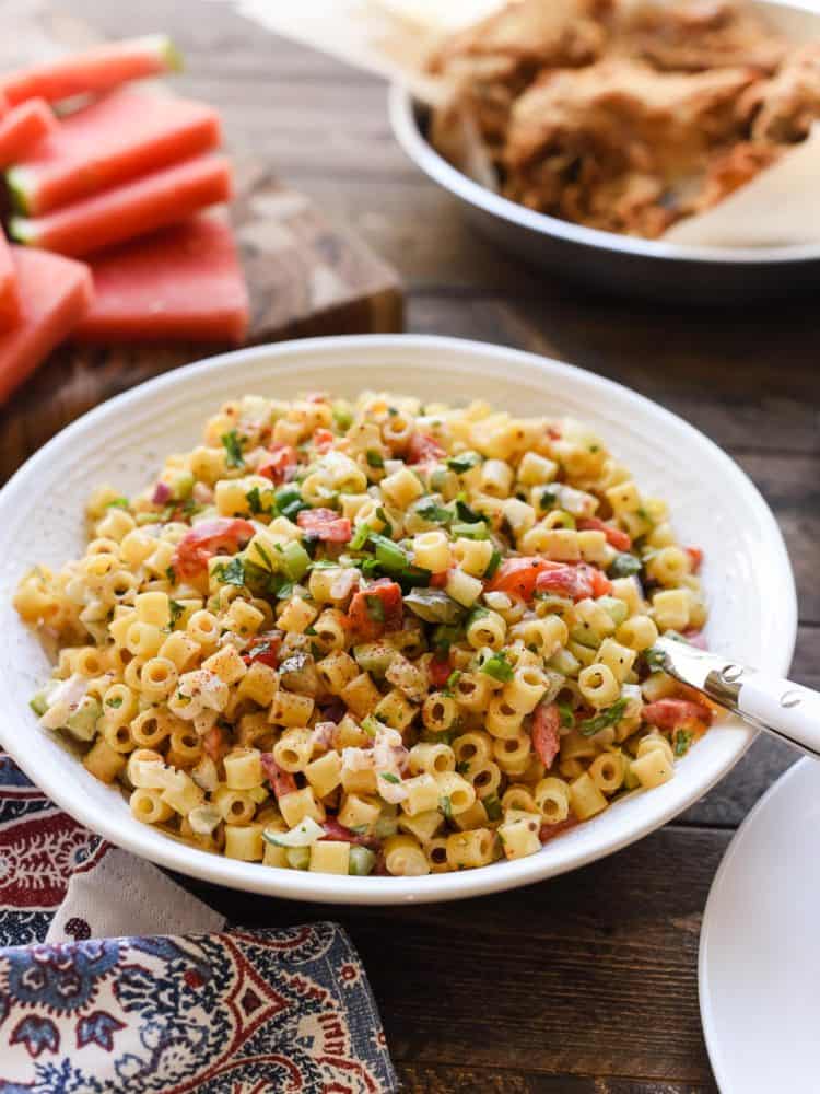 Fireworks Pasta Salad in a white bowl at a barbecue