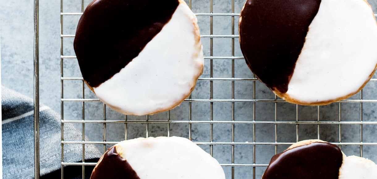 Black and White Cookies - a New York deli classic. Frosted with vanilla and chocolate icing, these cake-like cookies delivers the best of both worlds.