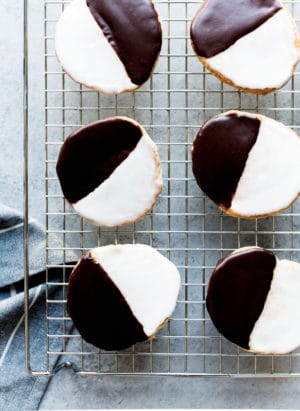 Black and White Cookies - a New York deli classic. Frosted with vanilla and chocolate icing, these cake-like cookies delivers the best of both worlds.