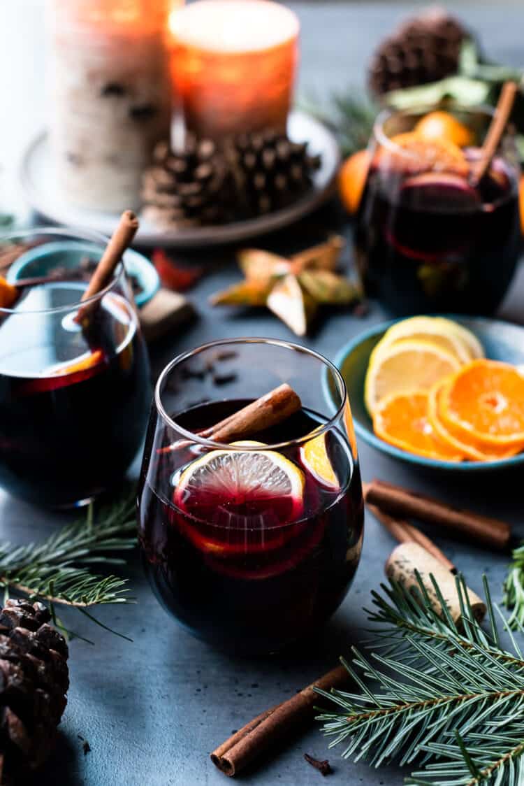 Glasses of mulled wine with citrus and spices for Christmas.