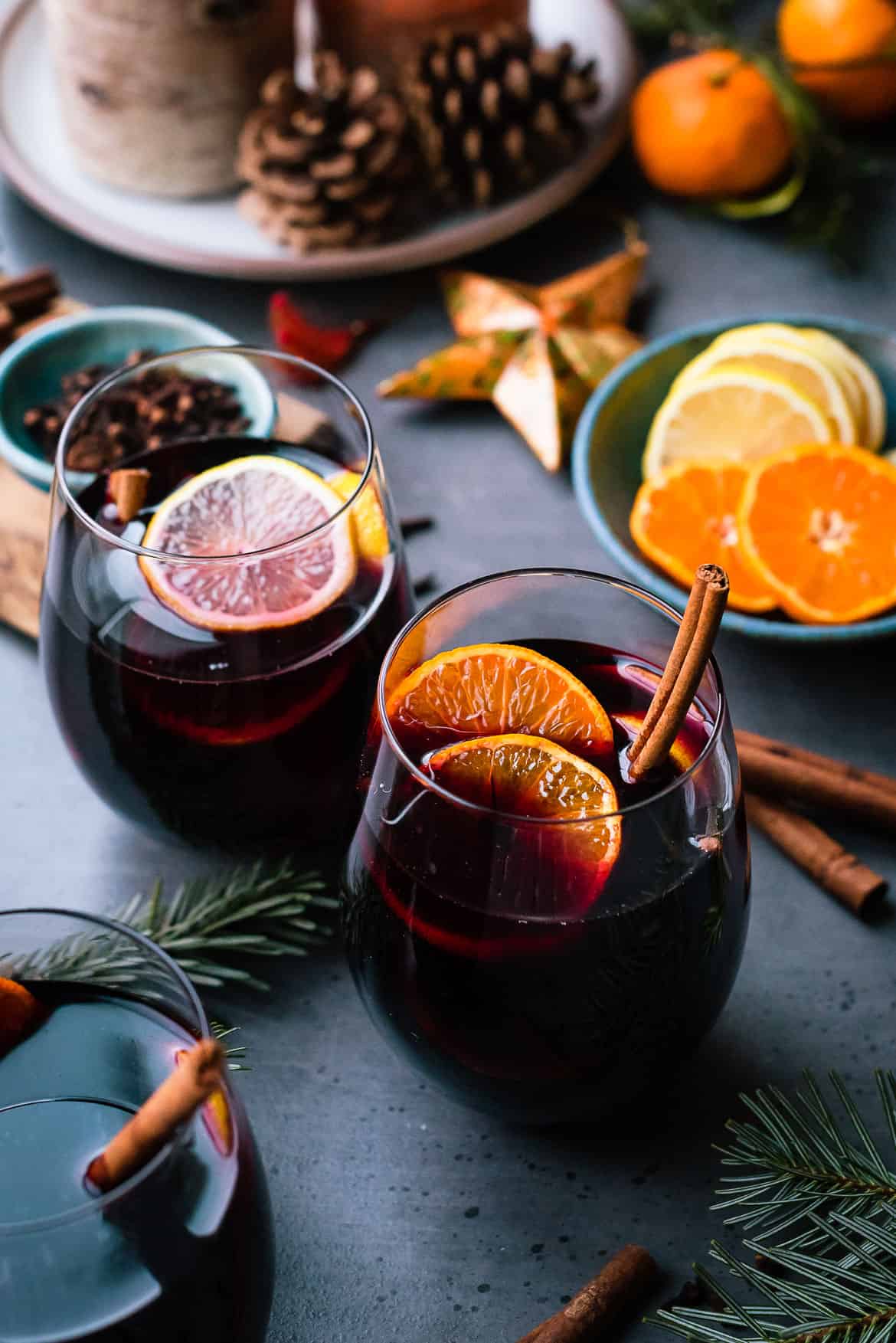 Two mulled wine glasses by the fireplace, christmas time Stock