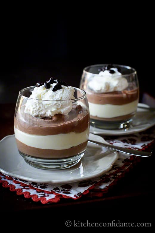 Triple Chocolate Mousse in cups with whipped cream.