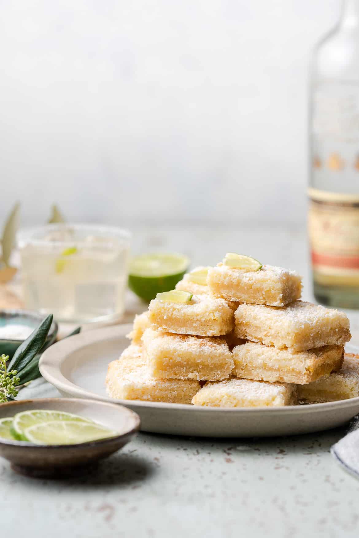 Margarita bars sliced and stacked on a plate.