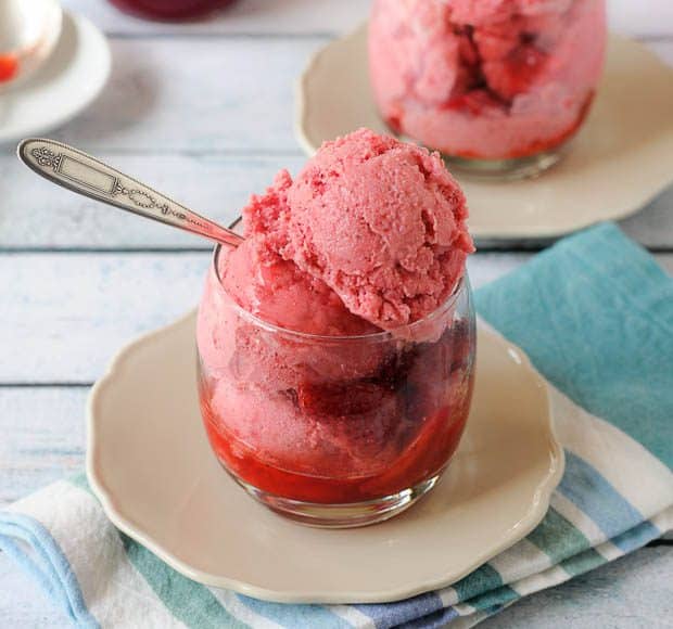 Glasses of strawberry sauce and homemade strawberry frozen yogurt.