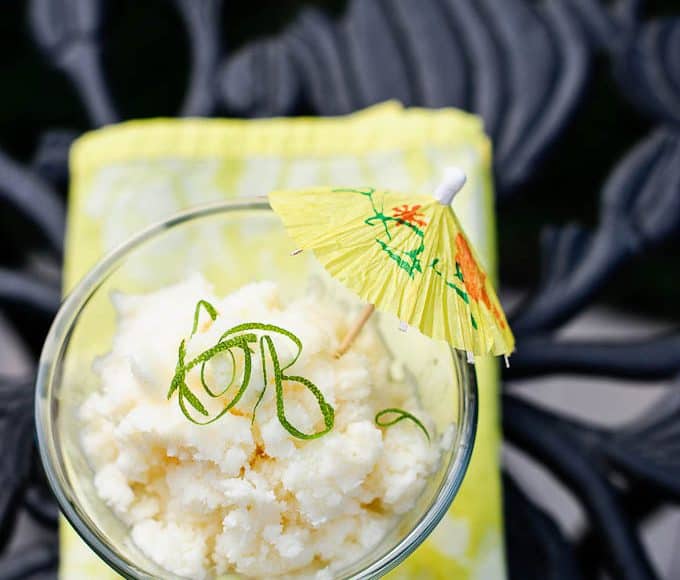 A pina colada granita with a yellow cocktail umbrella.