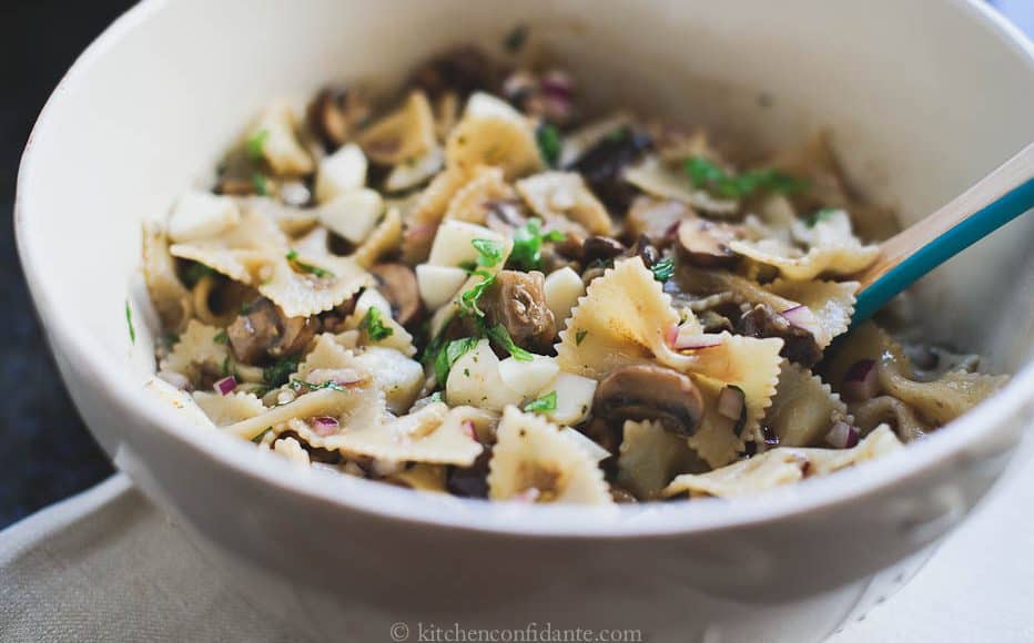 Warm Eggplant & Mushroom Pasta Salad in a white bowl ready to eat.