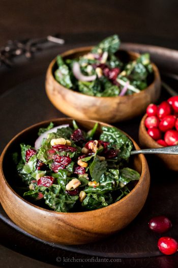 Cranberry Walnut Kale Salad in wooden bowls