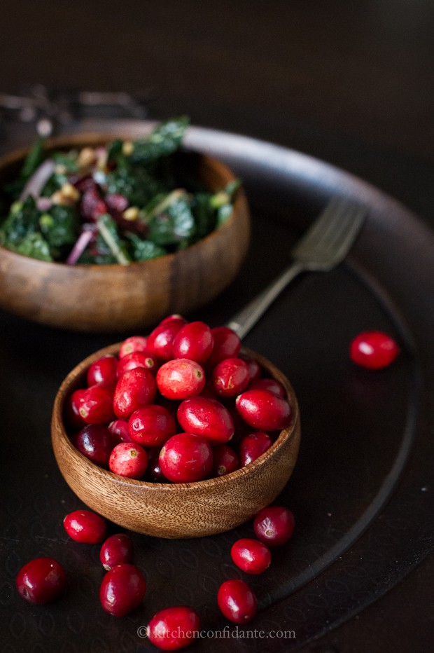 Fresh cranberries in a wooden bowl for Cranberry Walnut Kale Salad with Fresh Cranberry Vinaigrette