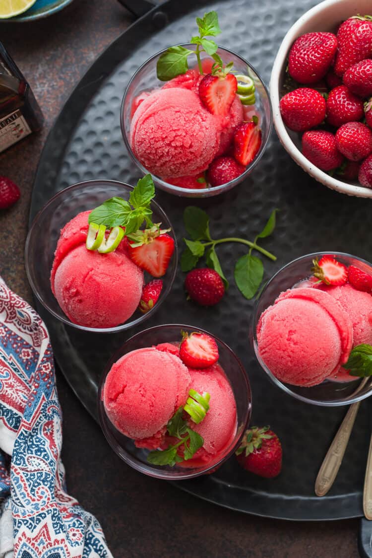 Strawberry Cointreau Sorbet scoops on a serving tray.