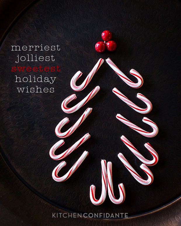 A picture of candy canes arranged to create a christmas tree shape topped by three red berries. Beside it, is text says, "merriest jolliest sweetest holiday wishes".