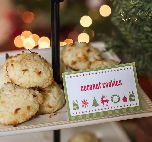 A decorative tiered stand full of cokies. A red and green sign says "coconut cookies".