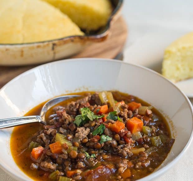 A bowl filled with hearty homemade beef and lentil chili.