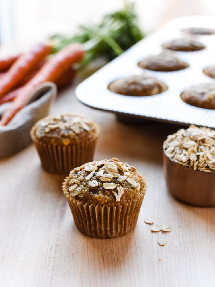 Carrot Oat Muffins on a table.