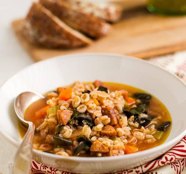A bowl of Farro Soup with Red Chard and Sausage.