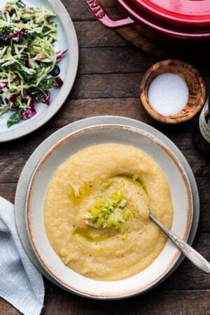 Creamy Cauliflower & Potato Soup in a bowl with leeks and pepper.