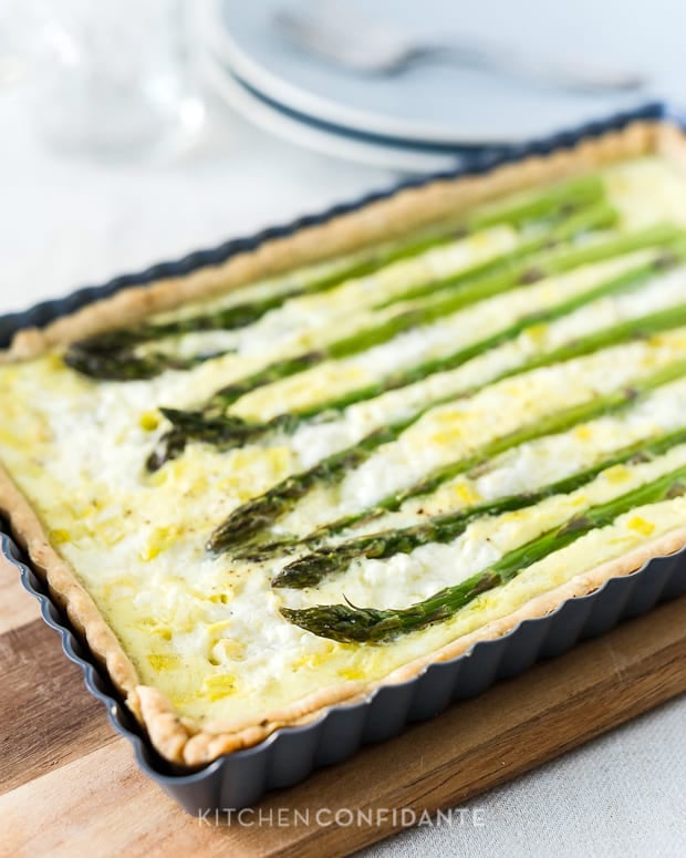 Buttermilk Asparagus Quiche with a row of fresh asparagus stalked baked in.