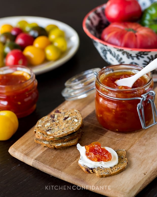 Tomato jam spread on a cracker.