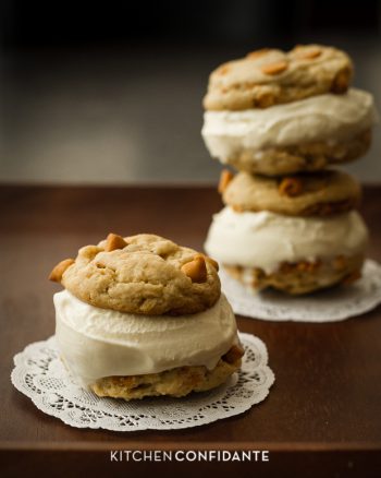 Homemade cookies with vanilla ice cream sandwiched between.