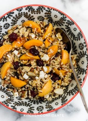 Wild Rice Salad with Apricots, Almonds and Apricot Dressing in a bowl.