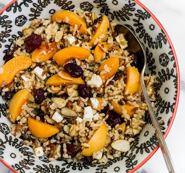 Wild Rice Salad with Apricots, Almonds and Apricot Dressing in a bowl.