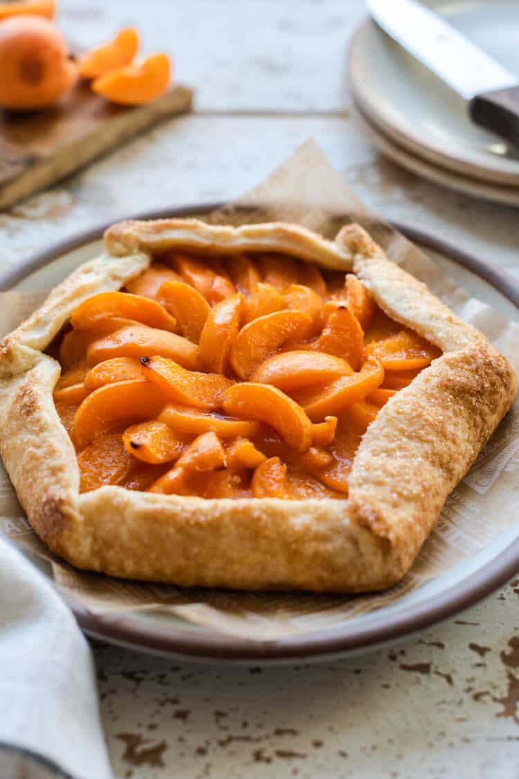 An apricot galette on a plate.