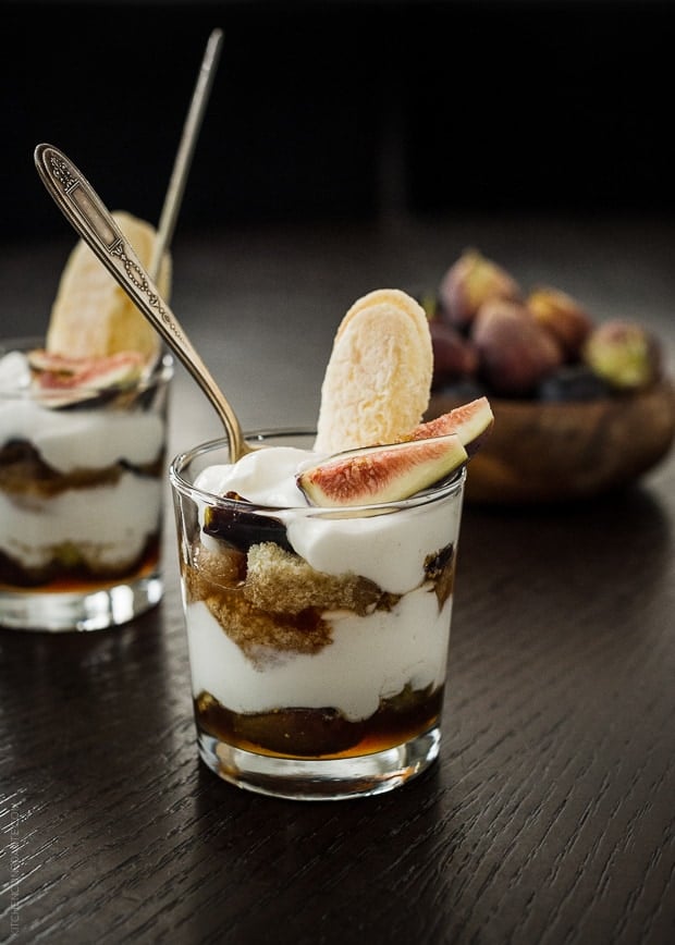 Dessert glasses of fig trifle: layered with honeyed figs, ladyfingers, and Greek yogurt cream.