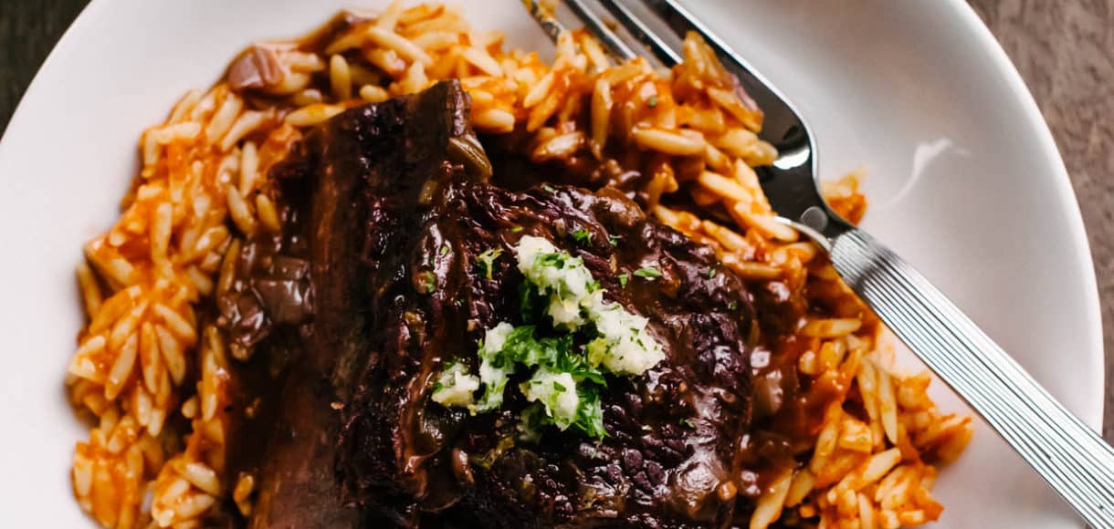 Braised Chipotle Short Ribs served on a white plate.