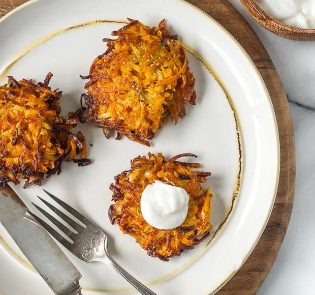 Sweet Potato, Turnip and Parsnip Latkes served on a white plate.