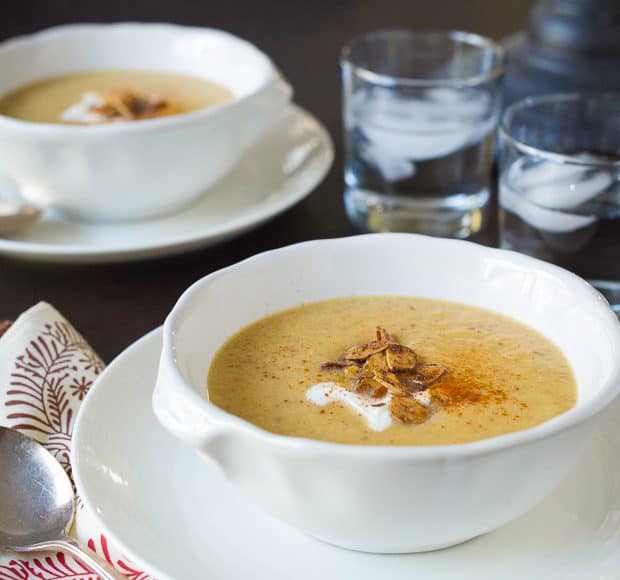 A bowl of creamy toasted almond butternut squash soup.