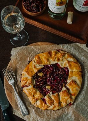 Cranberry Wine Galette served with a glass of wine.