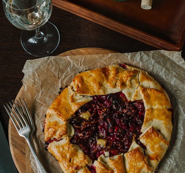 Cranberry Wine Galette served with a glass of wine.