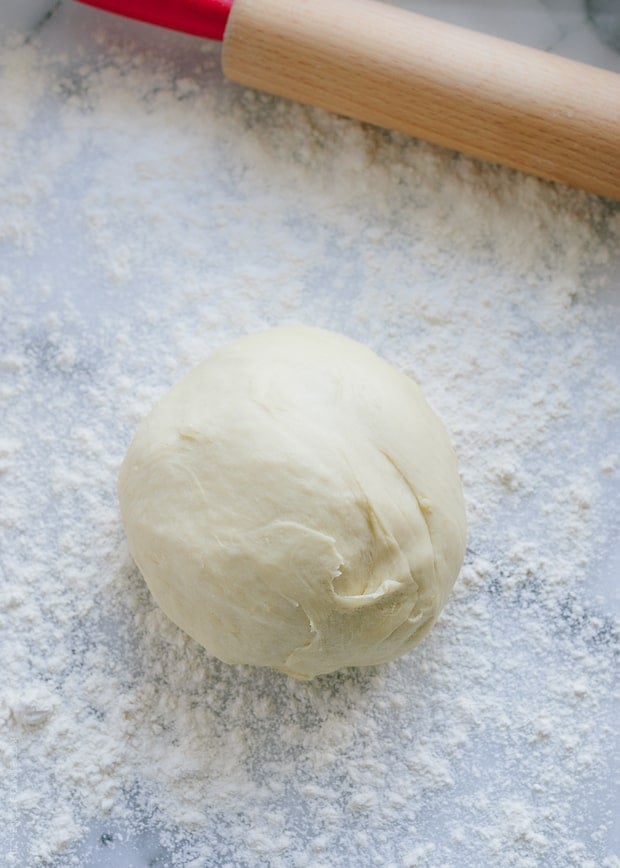Yeast dough on a floured surface.
