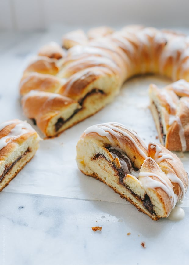 Braided Nutella Bread drizzled with a sugar glaze and sliced.