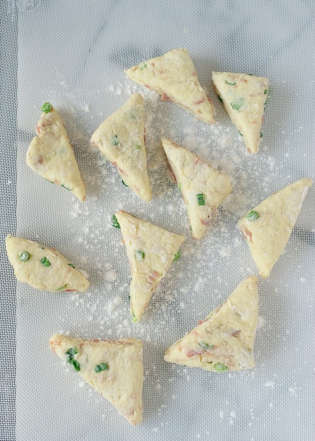 Savory Scones with Gruyere, Prosciutto and Green Onion on a marble counter, before baking
