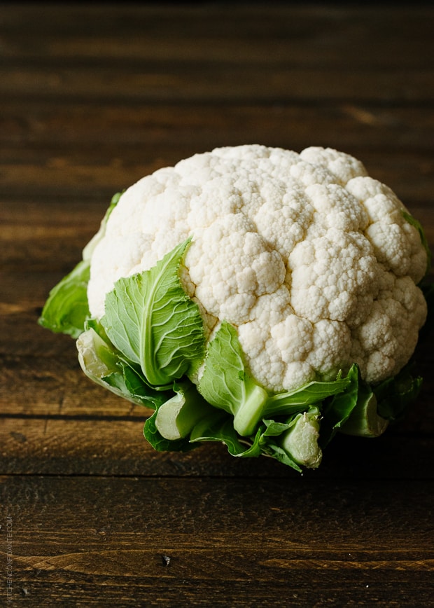 Cauliflower on a wooden surface.