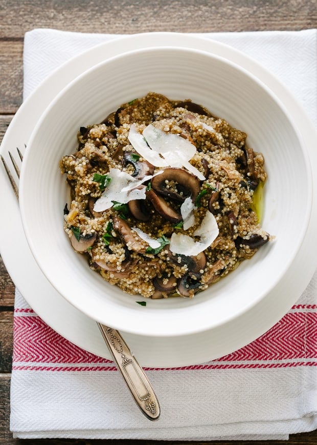A white bowl filled with Mushroom Quinoa Risotto.