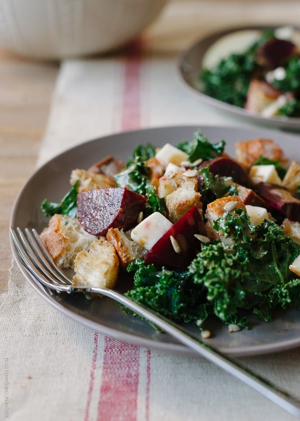 Roasted Beet and Kale Panzanella served on a plate with a fork.