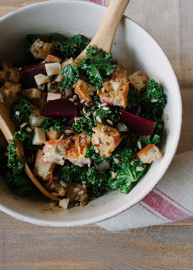 A large bowl filled with Roasted Beet and Kale Panzanella.