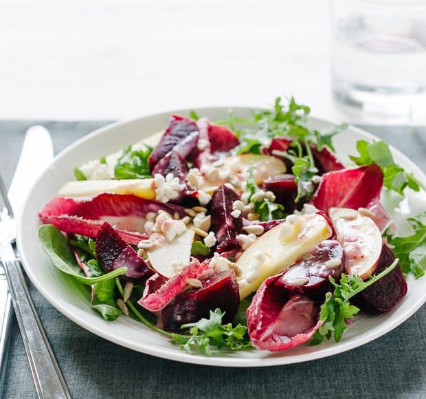 A large plate filled with Apple Beet Salad, Endive and Baby Greens.