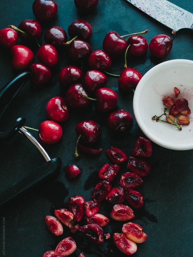 Pitting fresh cherries.