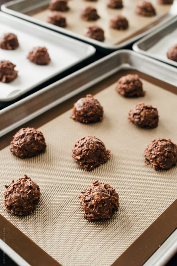 Chocolate Oatmeal Cookies scooped and arranged on baking trays.